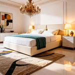 Luxurious bedroom with a large bed, chandelier, and nightstands.