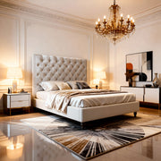 Luxurious bedroom with a tufted headboard, chandelier, and decorative rug.