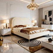 Luxurious bedroom with a large bed, chandelier, and decorative elements.