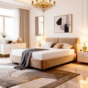 Modern bedroom with beige bed, chandelier, and abstract art on wall.