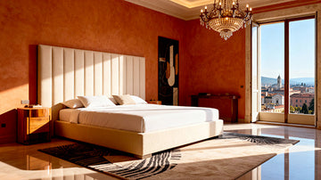 Luxurious bedroom with a large Belsogno Beds bed, orange walls, and a chandelier overlooking Brescia