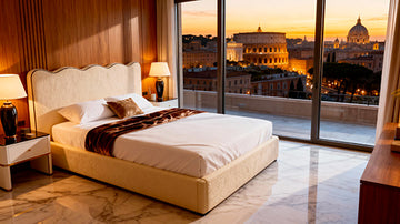 Luxury Belsogno Beds bedroom with a view of the Colosseum at sunset.